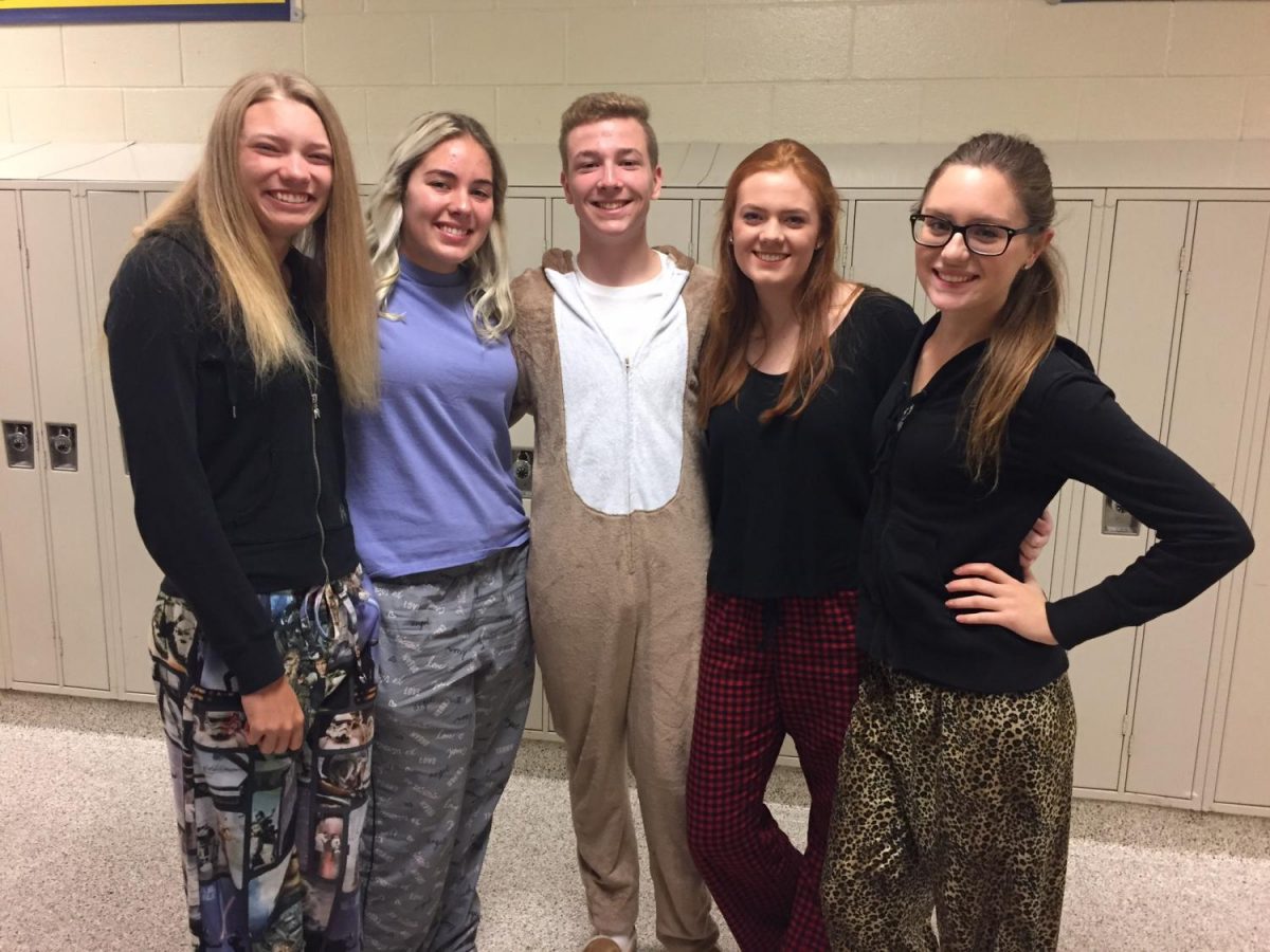 A group of seniors pose together in their favorite pajamas. 