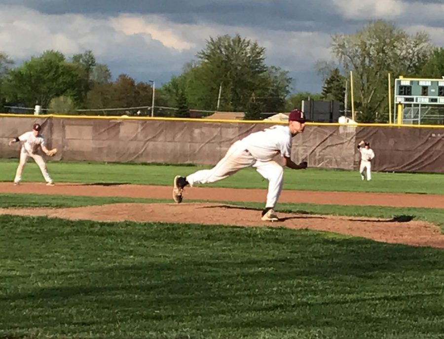 Junior pitcher Nolan Hood takes stride to finish his pitch.