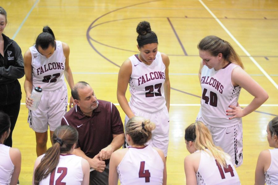 Head Varsity Girls Basketball coach Matt Joseph critiques his teams gameplay during a timeout during the 2017-2018 season.