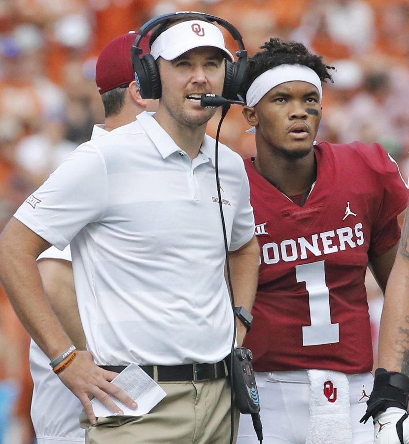Oklahoma head coach Lincoln Riley and quarterback Kyler Murray (1) confer during a game against Texas.